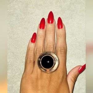 1 oversized cocktail ring pre-owned rose gold , and a black stone